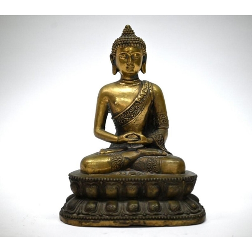 310 - A 19th century Chinese bronze Buddha, Shakyamuni, seated in the lotus position (padmasana) on a doub... 