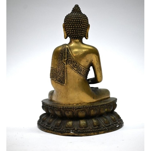 310 - A 19th century Chinese bronze Buddha, Shakyamuni, seated in the lotus position (padmasana) on a doub... 