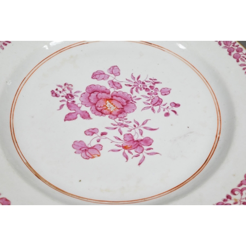 311 - An 18th century Chinese famille rose plate painted in puce enamels with peonies within an iron red a... 