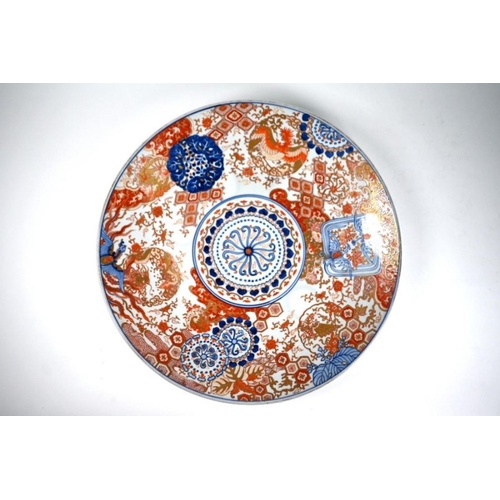 317 - A large 19th century Japanese Imari charger, Meiji period (1868-1912) painted in the typical palette... 