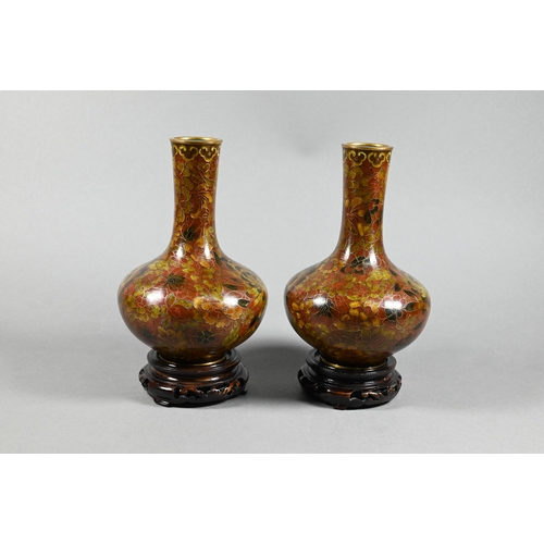 318 - A pair of 20th century Japanese cloisonne bottle vases decorated with floral designs in autumnal pal... 