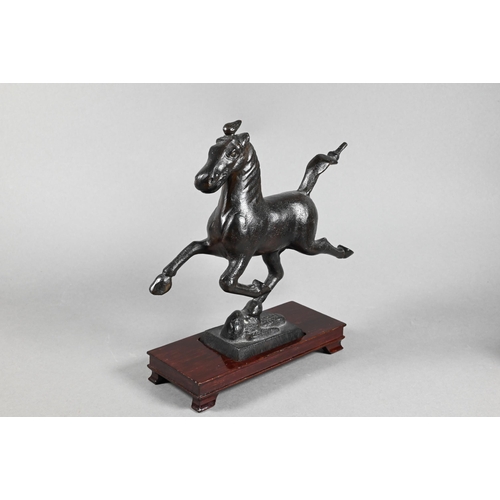 319 - A 20th century Chinese bronze replica figure of 'The Flying Horse of Gansu' modeled with one hoof re... 