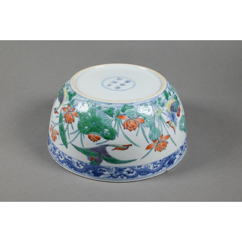 320 - A Chinese 18th century doucai 'duck and lotus' marriage bowl, finely painted in polychrome enamels w... 