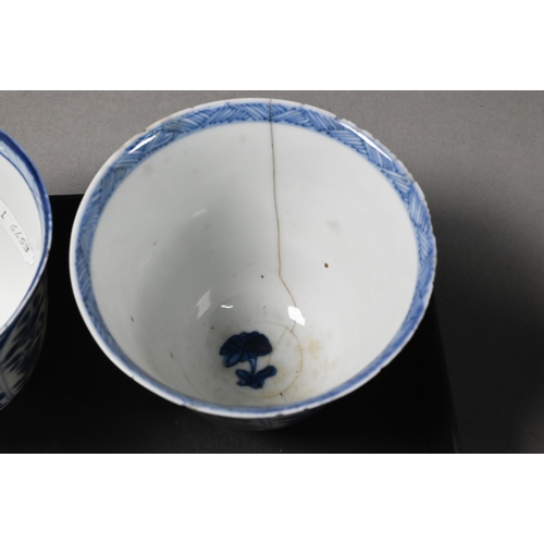 324 - Two 18th century Chinese blue and white tea bowls painted in underglaze blue with floral and foliate... 