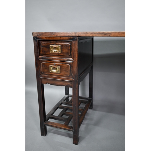 327 - An antique Chinese hardwood three section desk, the floating single panel top over twin drawers to e... 