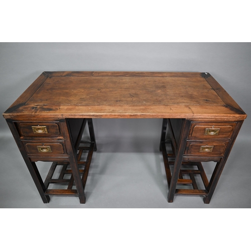 327 - An antique Chinese hardwood three section desk, the floating single panel top over twin drawers to e... 