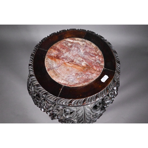 329 - An antique Chinese carved and moulded hardwood stand, the circular top with inset marble, 35 cm dia.... 