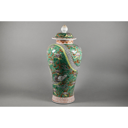 332 - A mid 20th century Chinese famille verte baluster vase with domed cover surmounted by lotus bud fini... 