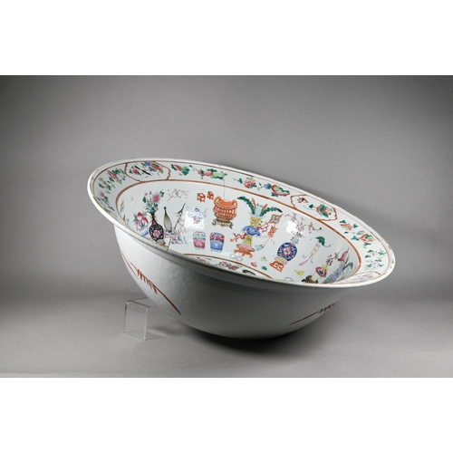 333 - A large 19th century famille rose bowl painted in polychrome enamels with 'one hundred antiques' des... 