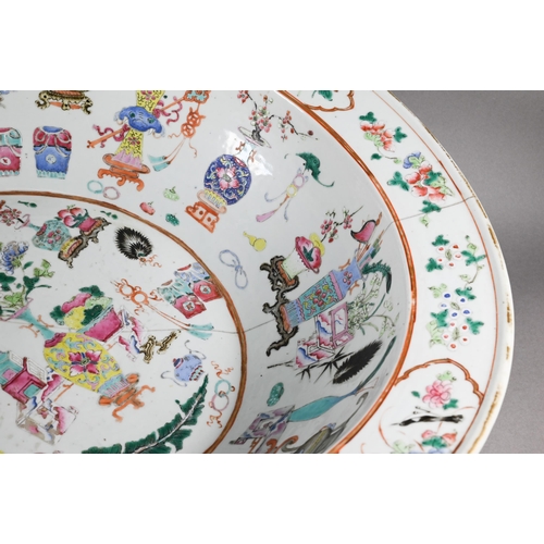 333 - A large 19th century famille rose bowl painted in polychrome enamels with 'one hundred antiques' des... 