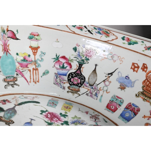 333 - A large 19th century famille rose bowl painted in polychrome enamels with 'one hundred antiques' des... 