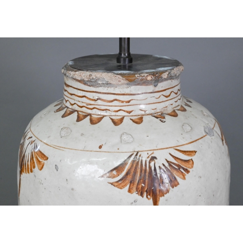 337 - A large Chinese Cizhou stoneware storage jar, probably Ming dynasty, covered with an ivory slip glaz... 