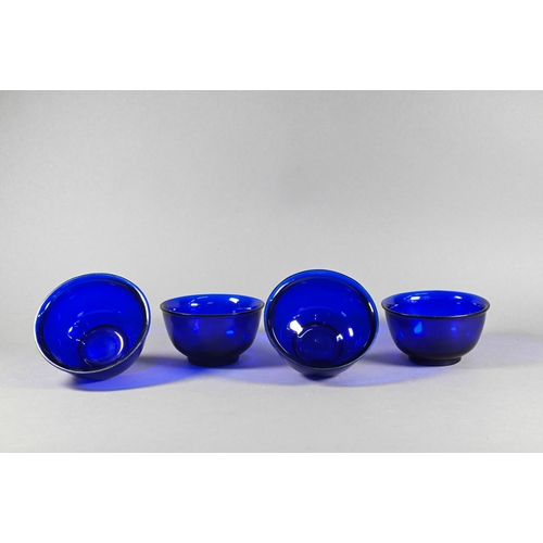 338 - Four Chinese Peking blue glass bowls with slightly everted rim, deep rounded sides and circular foot... 