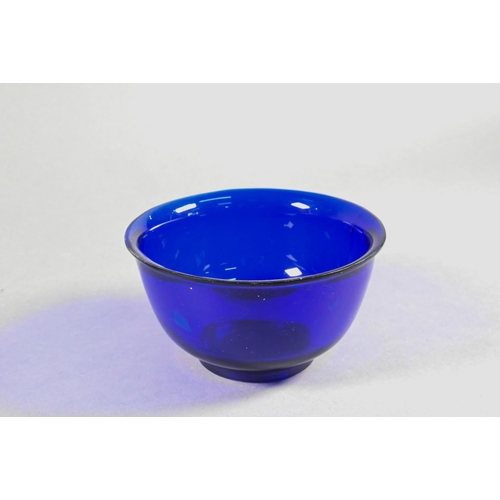 338 - Four Chinese Peking blue glass bowls with slightly everted rim, deep rounded sides and circular foot... 