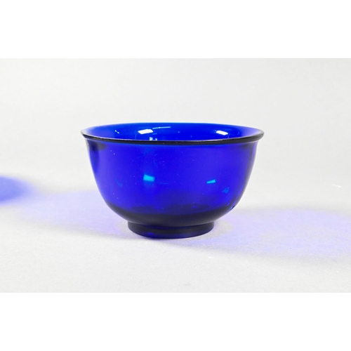 338 - Four Chinese Peking blue glass bowls with slightly everted rim, deep rounded sides and circular foot... 