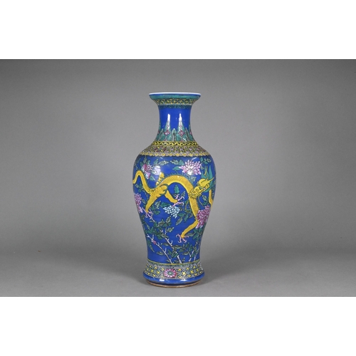 339 - A 19th century Chinese famille rose blue ground baluster vase, painted in polychrome enamels with tw... 