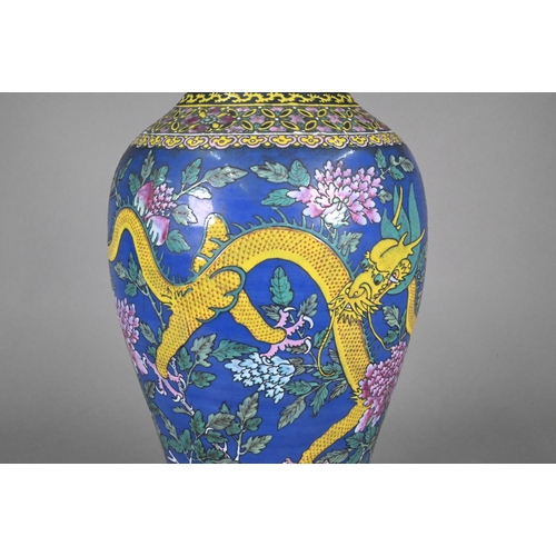 339 - A 19th century Chinese famille rose blue ground baluster vase, painted in polychrome enamels with tw... 