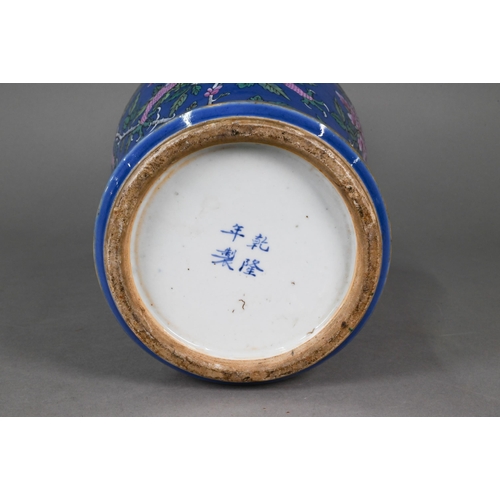 339 - A 19th century Chinese famille rose blue ground baluster vase, painted in polychrome enamels with tw... 