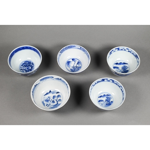 353 - A pair of 19th century Chinese blue and white tea bowls painted in underglaze blue with a figure lea... 