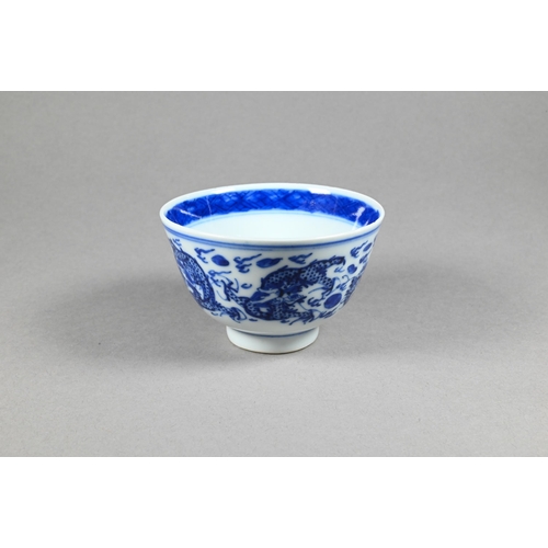 353 - A pair of 19th century Chinese blue and white tea bowls painted in underglaze blue with a figure lea... 