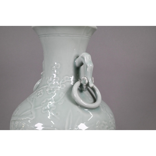 355 - A Chinese celadon vase of baluster form with gnarled prunus branch handles fixed ring handles, the b... 