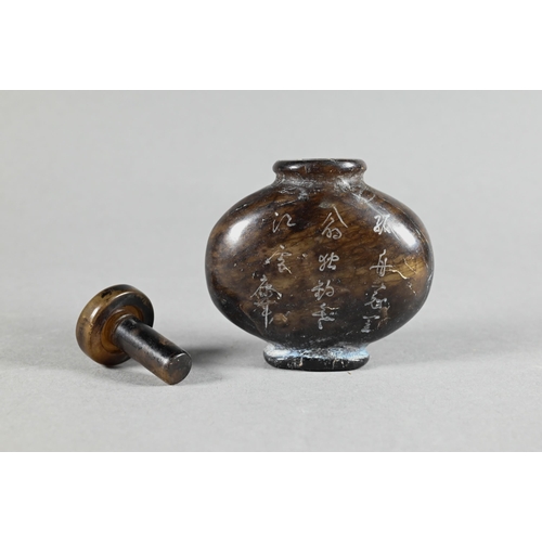 357 - A Chinese hardwood snuff bottle and stopper, stippled and carved in relief with taotie mask decorati... 