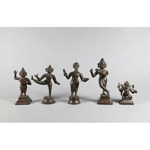 362 - An Indian brass figure of Bala Krishna (child Krishna) holding a butterball 11 cm high, a brass figu... 