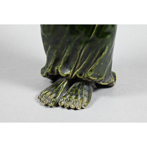 364 - A 19th century Chinese green-glazed ceramic figure of an emaciated Luohan, possibly Asita, standing ... 