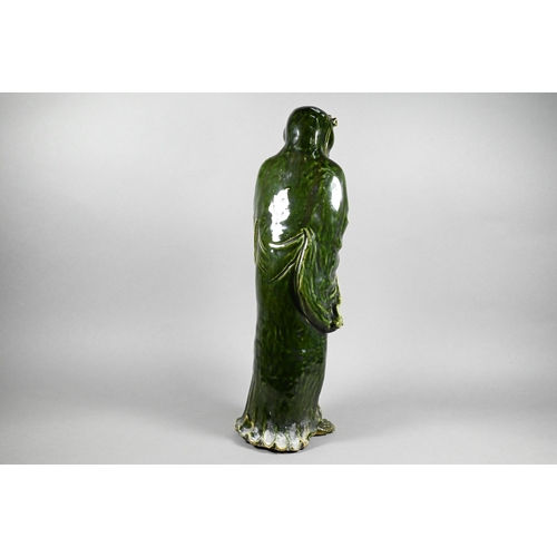 364 - A 19th century Chinese green-glazed ceramic figure of an emaciated Luohan, possibly Asita, standing ... 