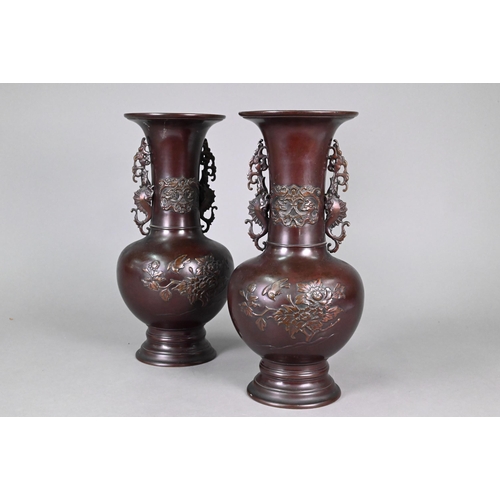 365 - A pair of late 19th or early 20th century Japanese bronze vases, the flaring necks with archaistic d... 