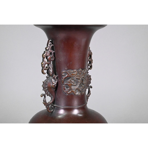 365 - A pair of late 19th or early 20th century Japanese bronze vases, the flaring necks with archaistic d... 