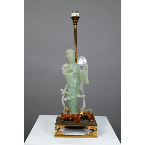 369 - A Chinese bowenite gilt metal and hardwood lamp, the pale green stone figure carved as a courtesan h... 