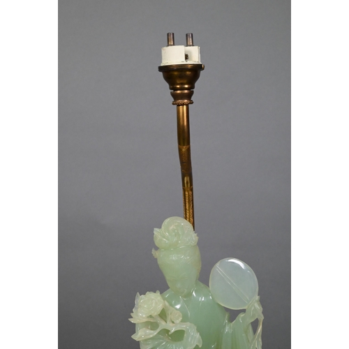 369 - A Chinese bowenite gilt metal and hardwood lamp, the pale green stone figure carved as a courtesan h... 