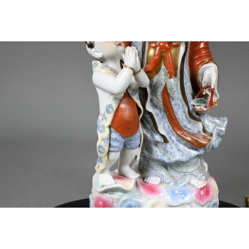 370 - A Chinese table lamp with porcelain figure group of Guanyin with a small child painted in polychrome... 