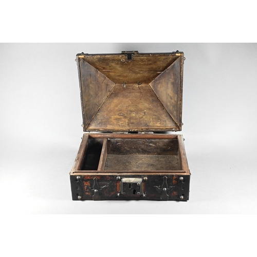 376 - An Indian Kerala Netturpetti jewellery casket of typical form, hardwood metal mounted body with vest... 