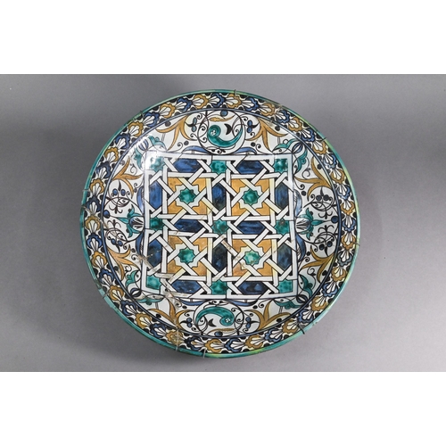 381 - A large 19th century Ottoman Iznik tin-glazed earthenware bowl with central geometric designs and fo... 