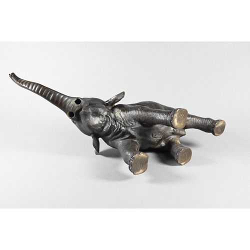 384 - A Japanese Meiji period (1868-1912) bronze elephant, modelled striding forward with raised trunk, si... 