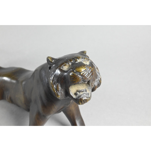 384A - A Japanese Meiji period (1868-1912) bronze prowling tiger signed by Seiya, 35 cm wide to/w a similar... 