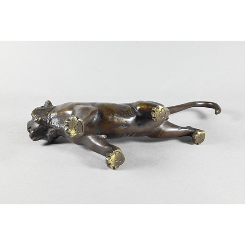 384A - A Japanese Meiji period (1868-1912) bronze prowling tiger signed by Seiya, 35 cm wide to/w a similar... 