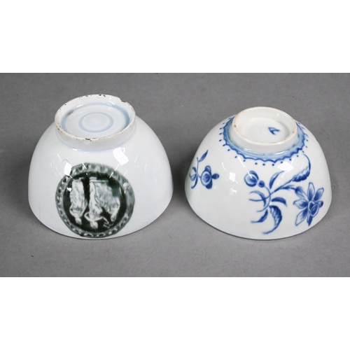 392 - A First Period Worcester tea bowl with sparsely-painted blue and white floral decoration, 7.5 cm dia... 