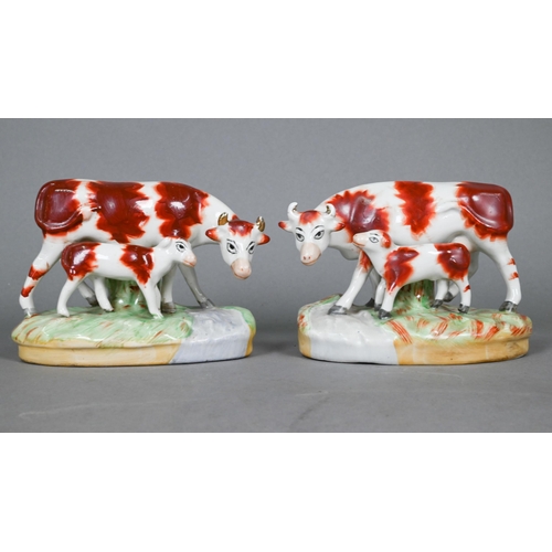 397 - Pair of 19th century Staffordshire pottery cows with calves, 10 cm high