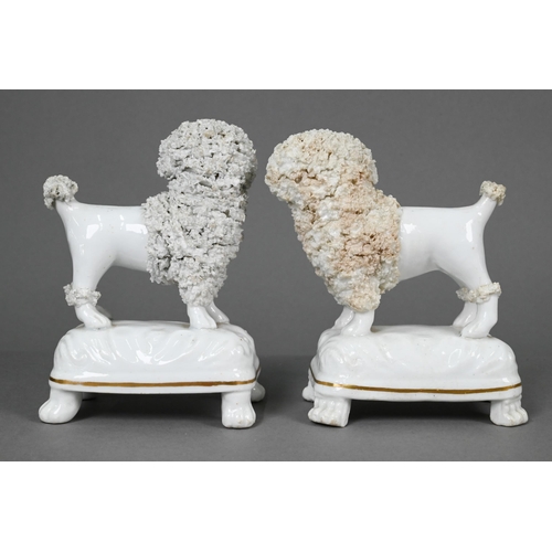 398 - Pair of Staffordshire pottery dalmatians, 13 cm high; a pair of poodles holding baskets of flowers i... 
