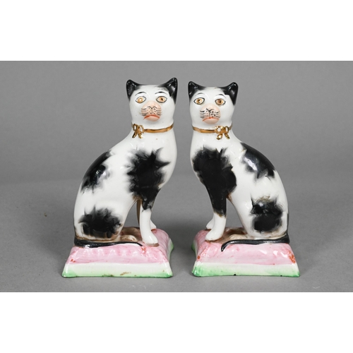 398 - Pair of Staffordshire pottery dalmatians, 13 cm high; a pair of poodles holding baskets of flowers i... 
