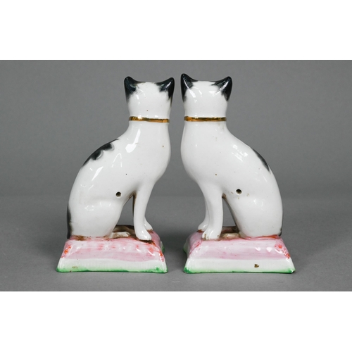 398 - Pair of Staffordshire pottery dalmatians, 13 cm high; a pair of poodles holding baskets of flowers i... 