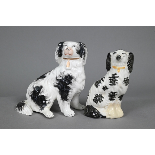 398 - Pair of Staffordshire pottery dalmatians, 13 cm high; a pair of poodles holding baskets of flowers i... 