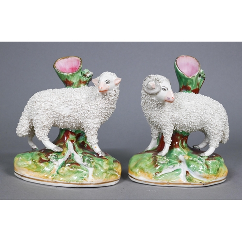 399 - Pair of 19th century Staffordshire spill vases, modelled with a ram and sheep with textured fleeces,... 