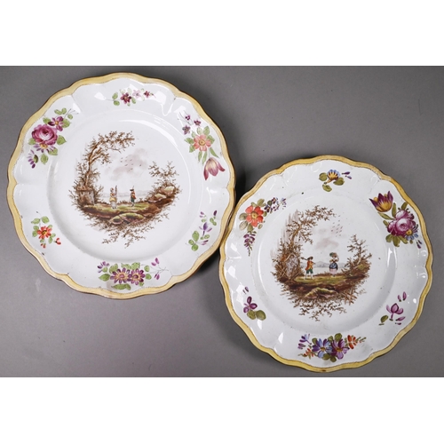 403 - A pair of French faience plates, bearing marks of Savy's factory (Marseilles c. 1770-90), painted wi... 