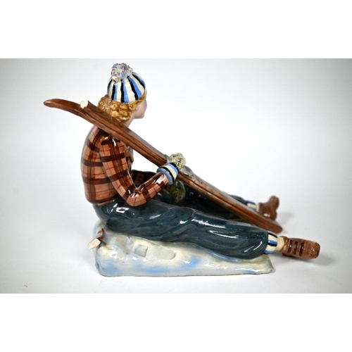 405 - Nove (Venice) pottery figure of a lady skier, seated on the snow and holding her skis, modelled by B... 