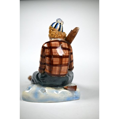 405 - Nove (Venice) pottery figure of a lady skier, seated on the snow and holding her skis, modelled by B... 