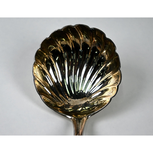 43 - A George II Irish silver punch ladle with shell bowl and floral-engraved Old English Pattern handle,... 